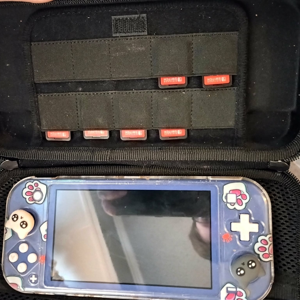 Nintendo Switch Lite With Carrying Case And 7 Games